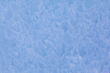 Texture of winter ice surface. Blue natural ice background