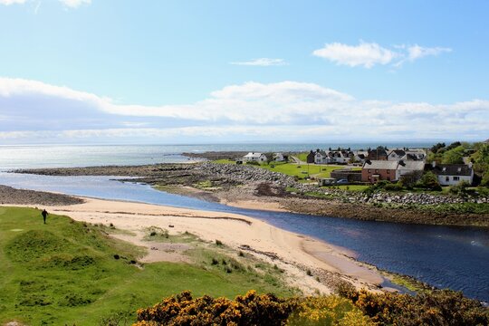 A beautiful view of the town of Brora, with homes along the coast on a sunny spring day in  Scotland in the Highlands