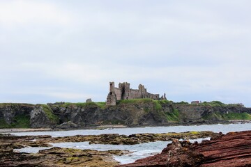 Incredible views of Tantallon Castle in East Lothian, Scotland.  The ancient castle sits atop the...