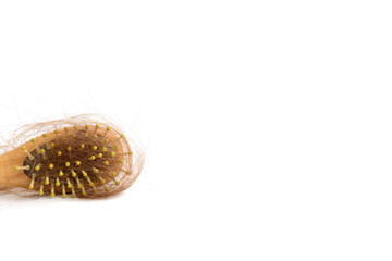 Hair loss and comb, hair loss every day, serious problems and hair loss on a white background.