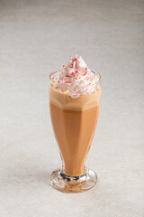 Portion of sweet frappe coffee with whipped cream