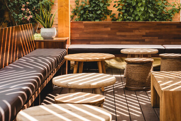 table and chairs in a restaurant under beautiful textured shade