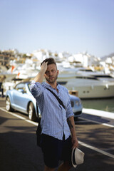 Obraz premium A man in a yacht marina in Marbella, Spain.