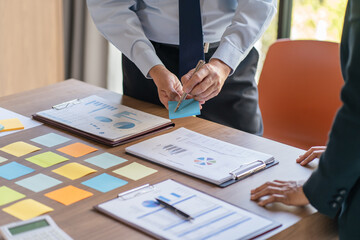 Business People brainstorming Meeting Design Ideas use post it notes to share idea professional investor start up project business brainstorming planning in office