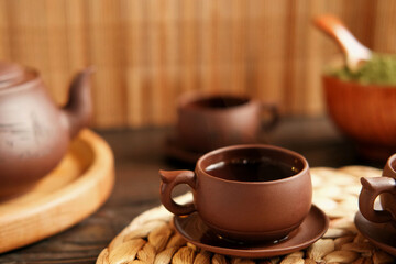 Tea Ceremony. Traditional Asian Tea Utensil, Serving Authentic Set. Person Pouring Tea from Brown...