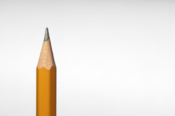 close-up of the tip of a wooden pencil on a white background