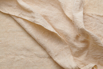 Linen crumpled texture natural fabric background closeup