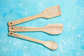 top view various wooden spoons on blue background stock photo