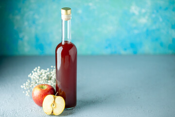 front view apple vinegar on light blue background alcohol fruit color photo