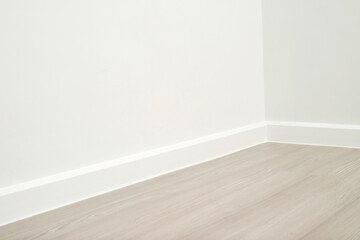 Wooden floors and beautiful white wall-mounted cornices in the house.