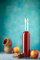 front view apple vinegar with apples on the blue background juice fresh drink sour food color red fruit