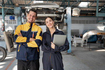 Caucasian woman mechanic checking brake disc at car service