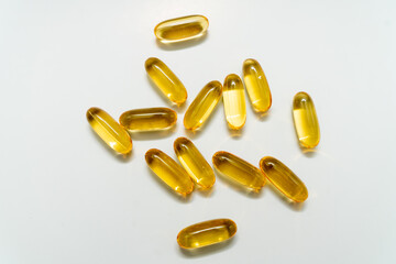fish oil capsules on white background 