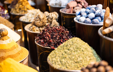 United Arab Emirates, Dubai district Deira, spice market, April 2023. Old traditional souk for spices and herbs. Curry, masala, pepper, dried blossoms, paprika, saffron, red pepper, mint, kind teas.