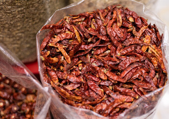 United Arab Emirates, Dubai, spice market, April 2023: Old souk bazaar market with herbs and spices. Close-up dried pods.