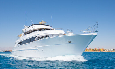 Obraz na płótnie Canvas Luxury private motor yacht sailing at sea