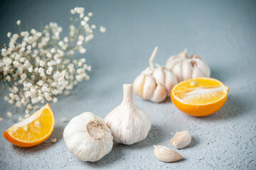 front view fresh garlics with lemon on light background food plant vegetable pepper sour seasoning