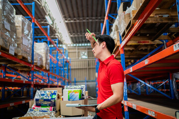 Worker inspects cardboard boxes in a large warehouse. distribution center Inventory management. warehouse, warehouse, industry