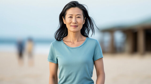 Middle age Asian woman enjoying a quiet beach time. Portrait of a female in her 40s, 50s. Generative AI