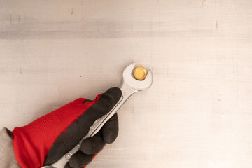  Cropped image of hand holding wrench on white background