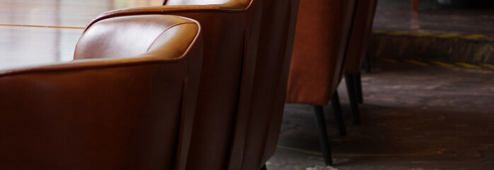 cozy leather sofa chairs restaurant cafe lounge interior furniture banner with copy space