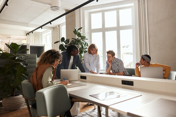 Diverse businesspeople working at an office table