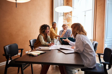 Diverse businesspeople going over paperwork