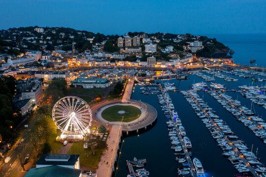 Torquay, Devon, United Kingdom. 05.28.2023 The English Riviera Wheel shines bright across Torquay Marina. Aerial Image. 28th May 2023.