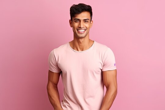 Photo realistic athletic Indian male model wearing a t-shirt pink background generative ai