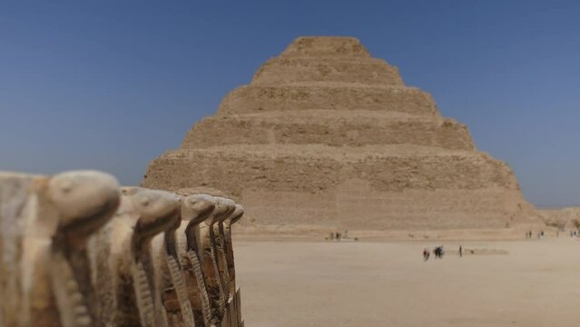 Djoser pyramid also called as Step Pyramid. Close up of ancient snakes.