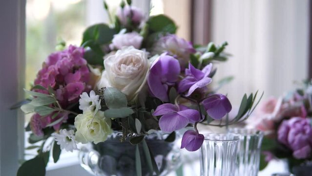 A fresh, purple floral arrangement in an indoor setting.