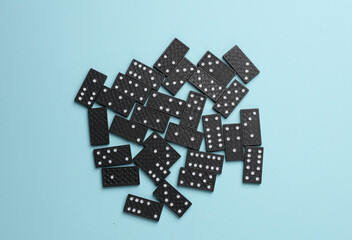 Many Dominoes on a blue background.