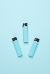 Lighters on a blue background. Minimalism.