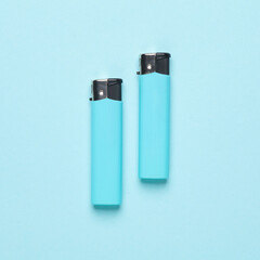 Lighters on a blue background. Minimalism.