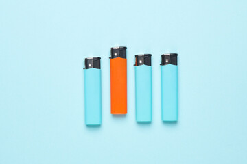 Lighters on a blue background. Minimalism.