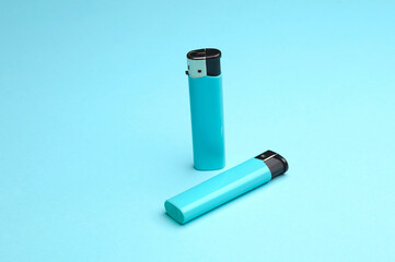 Lighters on a blue background. Minimalism.