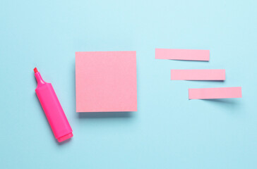 Pink blank note memo stickers on blue pastel background