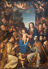 Fototapeta na wymiar NAPLES, ITALY - APRIL 19, 2023: The painting of Madonna among the saints in the church Chiesa del Gesu Nuovo by Giovanni Bernardino Azzolino (1614).