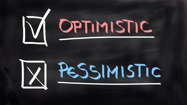 Optimistic pessimistic concept handwritten on blackboard