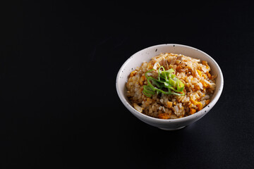 Japanese fried rice yakimeshi isolated in black background