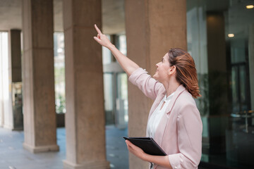 Fototapeta premium Young business woman pointing out the problems that need to be solved. Concept: director, business, reform