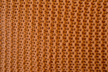 Closeup od brown knitted material - obrazy, fototapety, plakaty