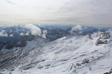 View from the Zugspitze on snow-covered mountains of the alps.