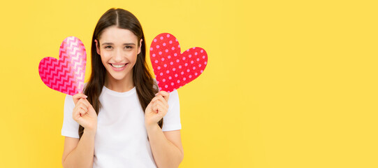 Beautiful amazing woman cuddle paper card heart shape, dreamy isolated on yellow background. Love...
