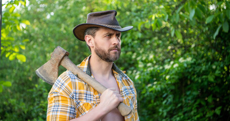 photo of rancher with axe, banner. rancher with axe. rancher with axe wearing checkered shirt.