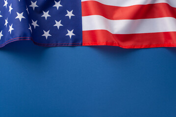 American federal holiday concept. High angle view photo of american flag at the top on blue...