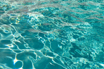 defocused pool water summertime background. defocused pool water background