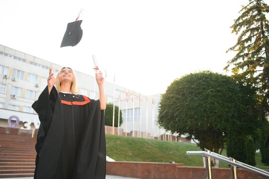 Portrait of a happy woman on her graduation day at university. Education and people.