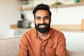 Portrait Of Handsome Cheerful Indian Man Posing At Home