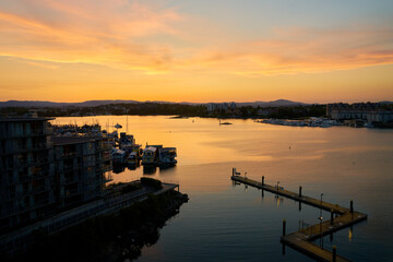 Victoria Harbour Sunset Twilight BC. Warm sunset over fisherman’s wharf and Victoria Harbor. British Columbia, Canada. 

